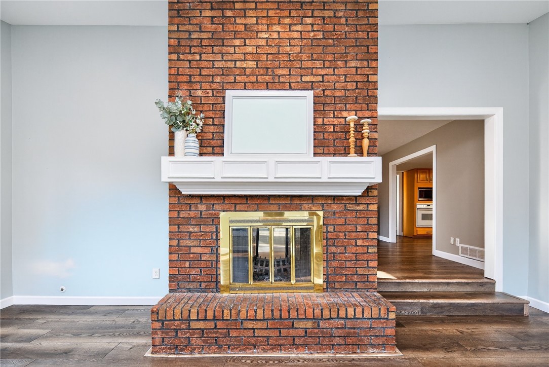 4747 Fawnwood Road Dayton, OH 45429 - Photo 20 of 58 This inviting living space features a charming brick fireplace, perfect for cozy gatherings.