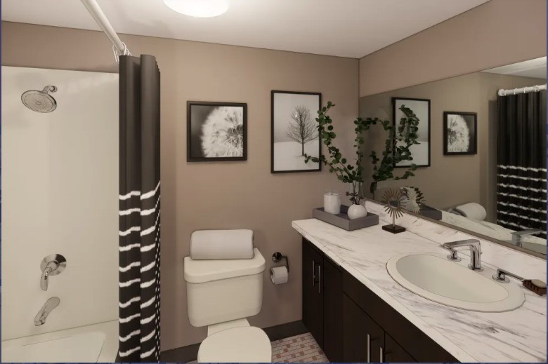 4205 Hatch Boulevard Sheffield, AL 35660 - Photo 11 of 12 a bathroom with a sink toilet and shower