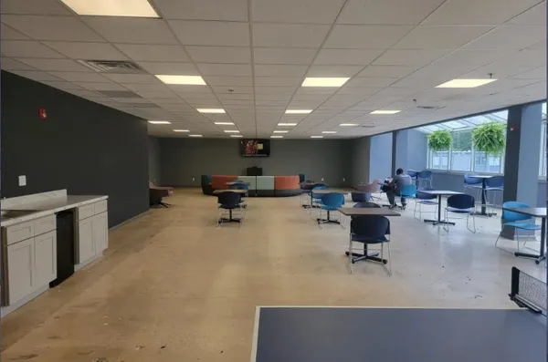 a kitchen with stainless steel appliances a stove a microwave a sink and a refrigerator