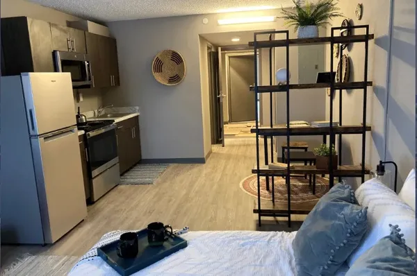 a dining room with furniture and window