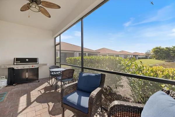 a view of a chairs and table in patio