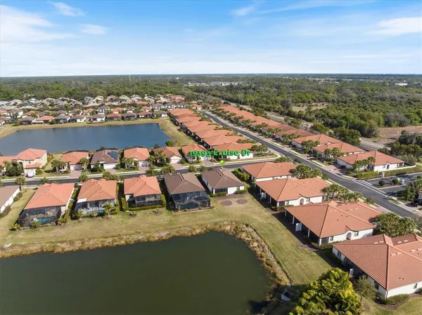 an aerial view of a house with a lake view