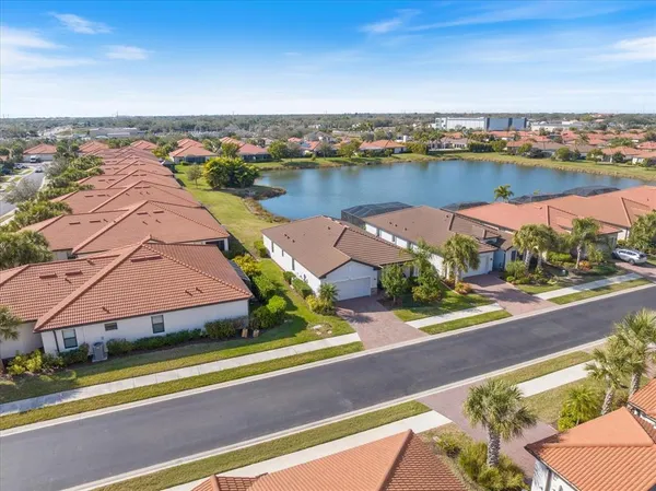 an aerial view of residential houses with city view