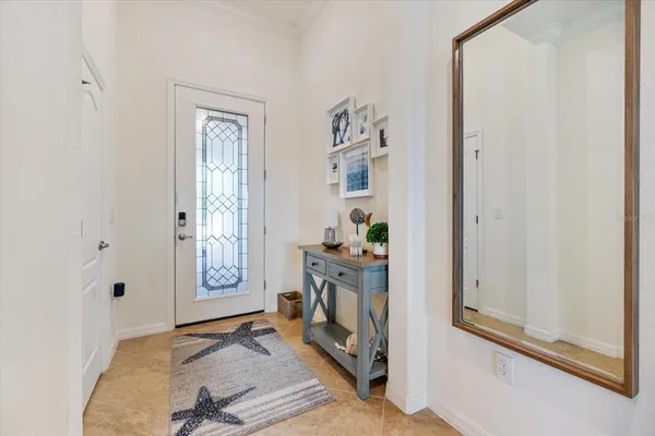 a view of a livingroom with wooden floor and a fireplace
