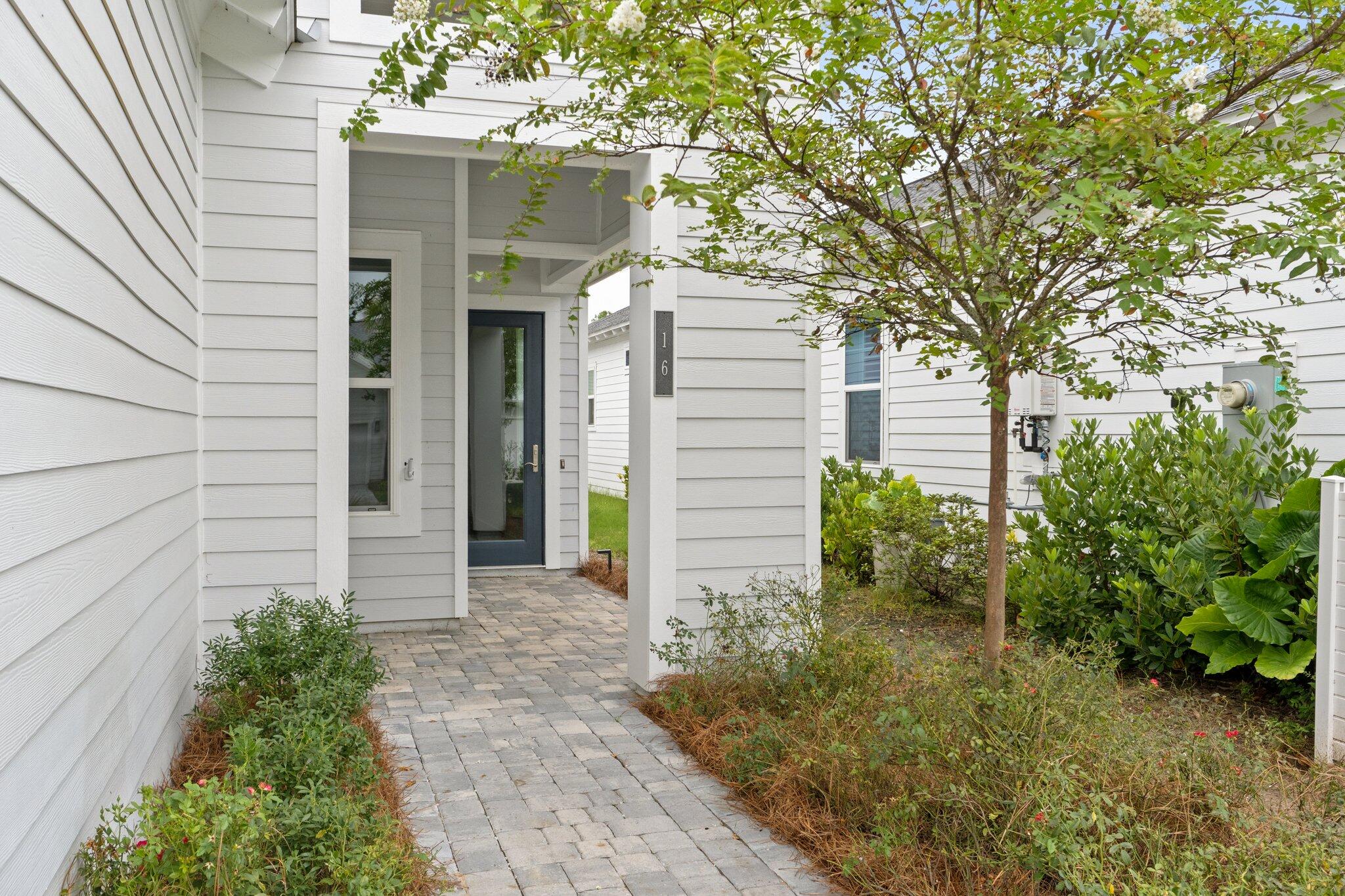 a front view of a house with garden
