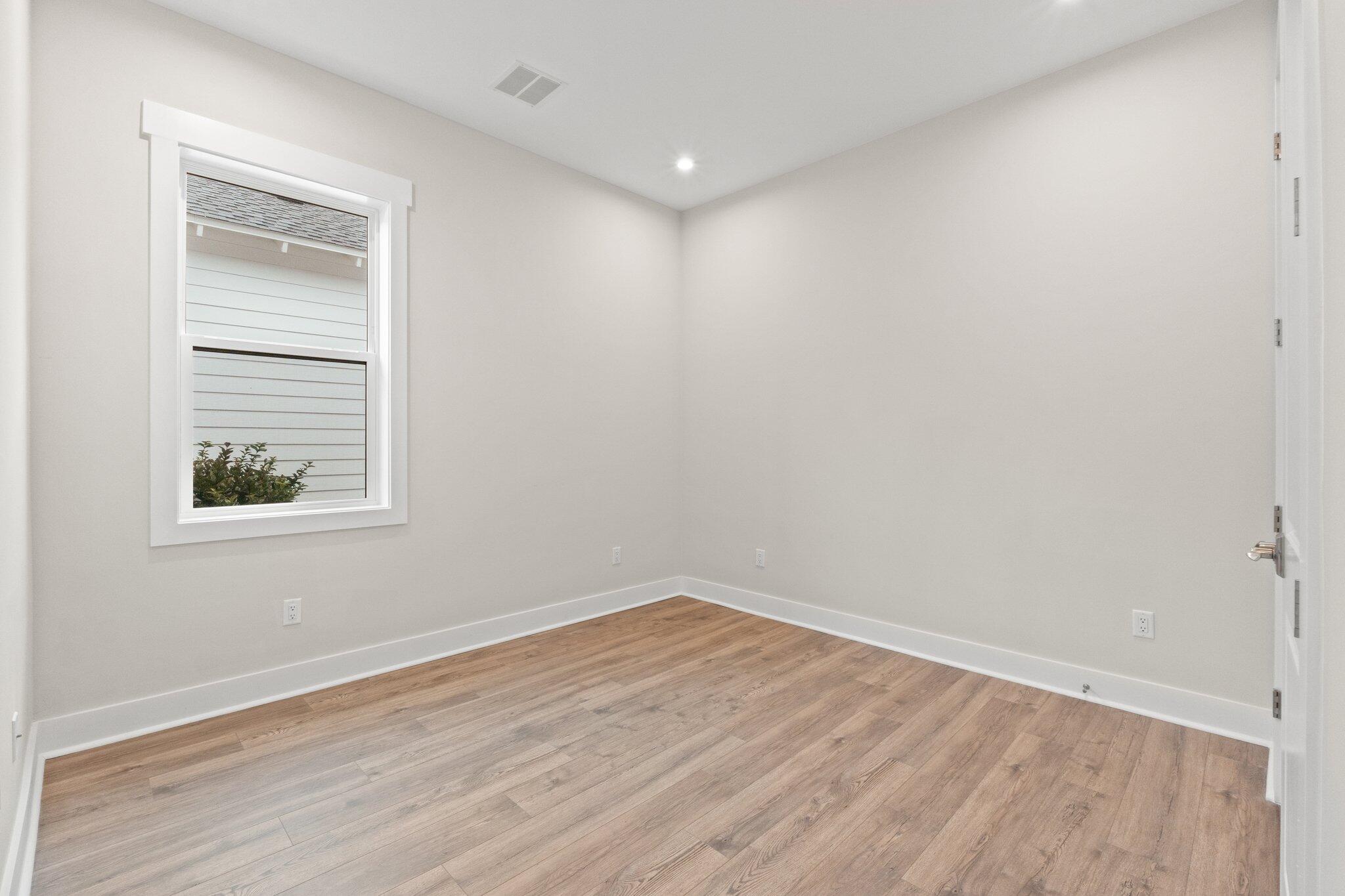16 Ravine Rd Inlet Beach Inlet Beach, FL 32461 - Photo 7 of 31 a view of empty room with wooden floor and fan