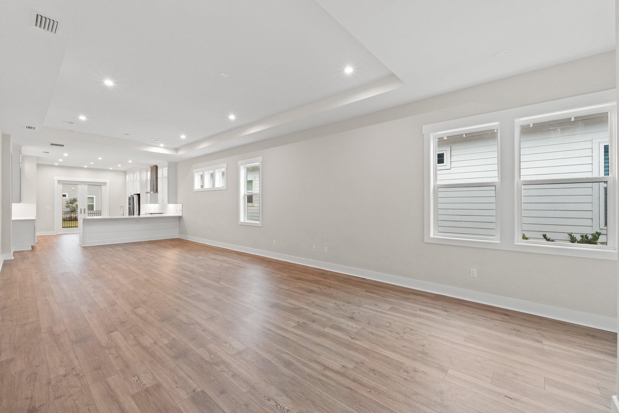 16 Ravine Rd Inlet Beach Inlet Beach, FL 32461 - Photo 10 of 31 a view of empty room with wooden floor and kitchen view