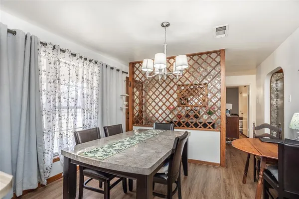 a kitchen with stainless steel appliances granite countertop a sink and a refrigerator