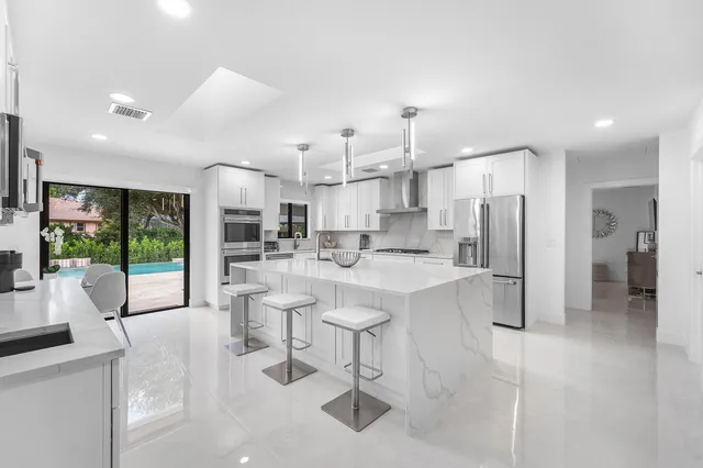 a spacious bedroom with a bed and a couch