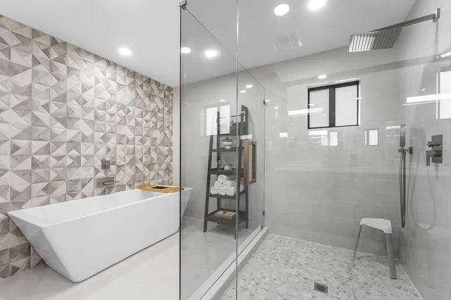 a view of a patio with a table and chairs under an umbrella