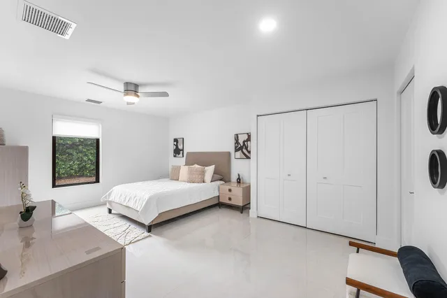a front view of a house with a yard table and chairs