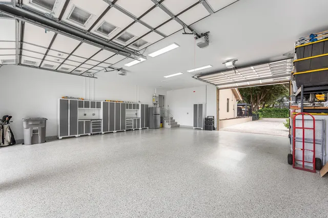 a view of a patio with table and chairs with wooden floor and fence