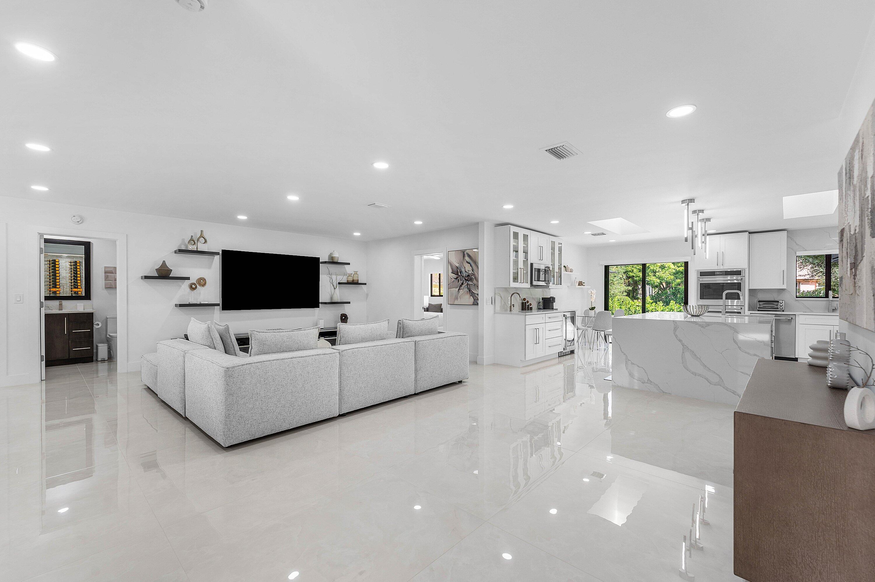 8274 Sawpine Road Delray Beach, FL 33446 - Photo 7 of 63 a living room with furniture and a flat screen tv