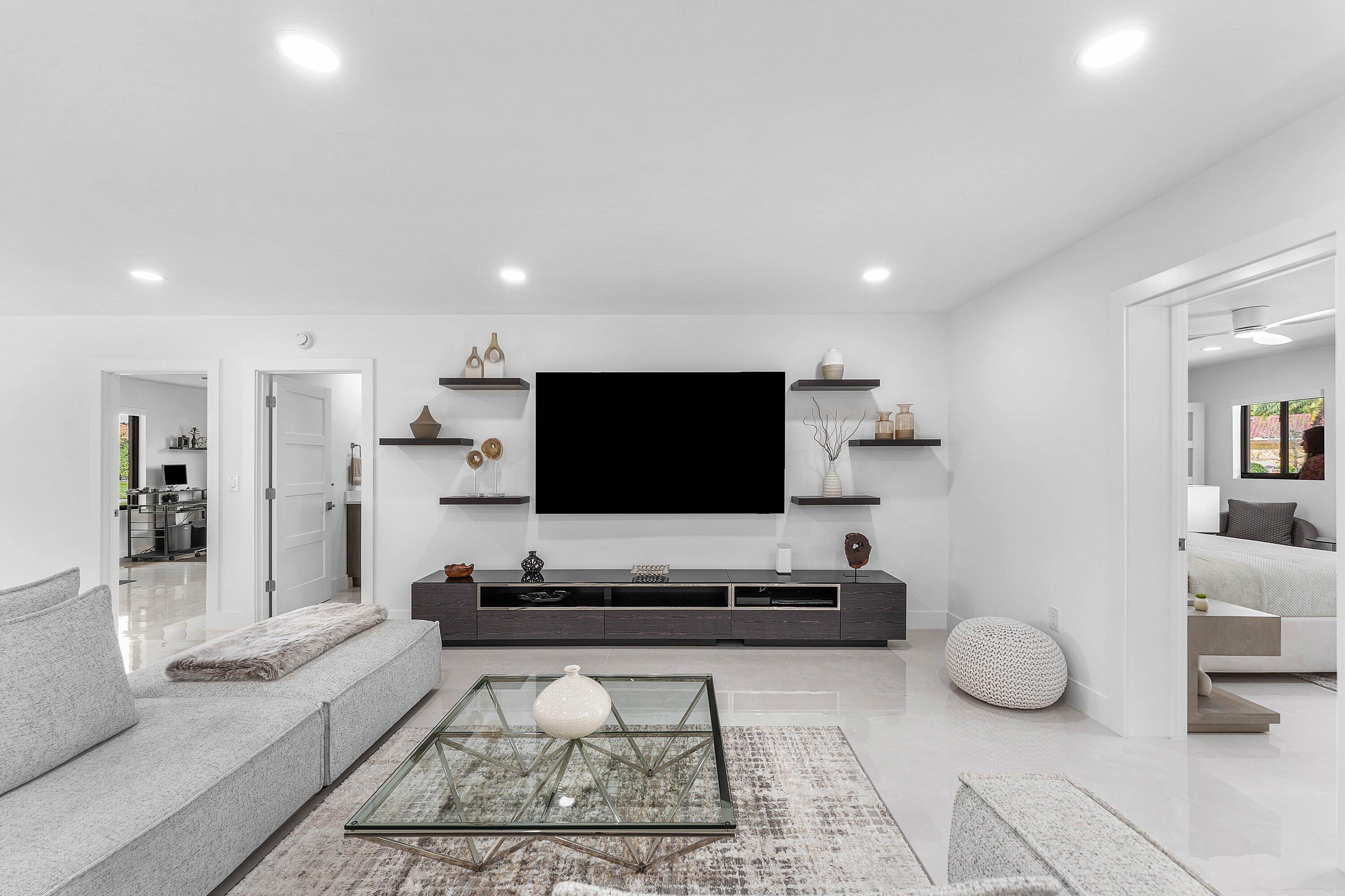 8274 Sawpine Road Delray Beach, FL 33446 - Photo 9 of 63 a living room with furniture and a flat screen tv