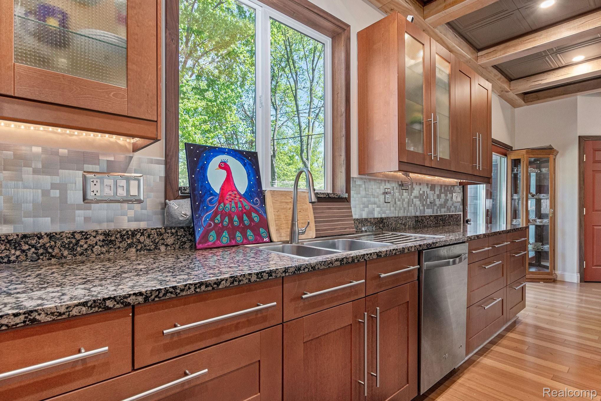 1155 Michelson Road Rochester, MI 48307 - Photo 6 of 36 Huge gourmet kitchen with custom made Maple and Black Walnut coffered ceiling, granite counters, & hardwood floors. This is a must see kitchen!