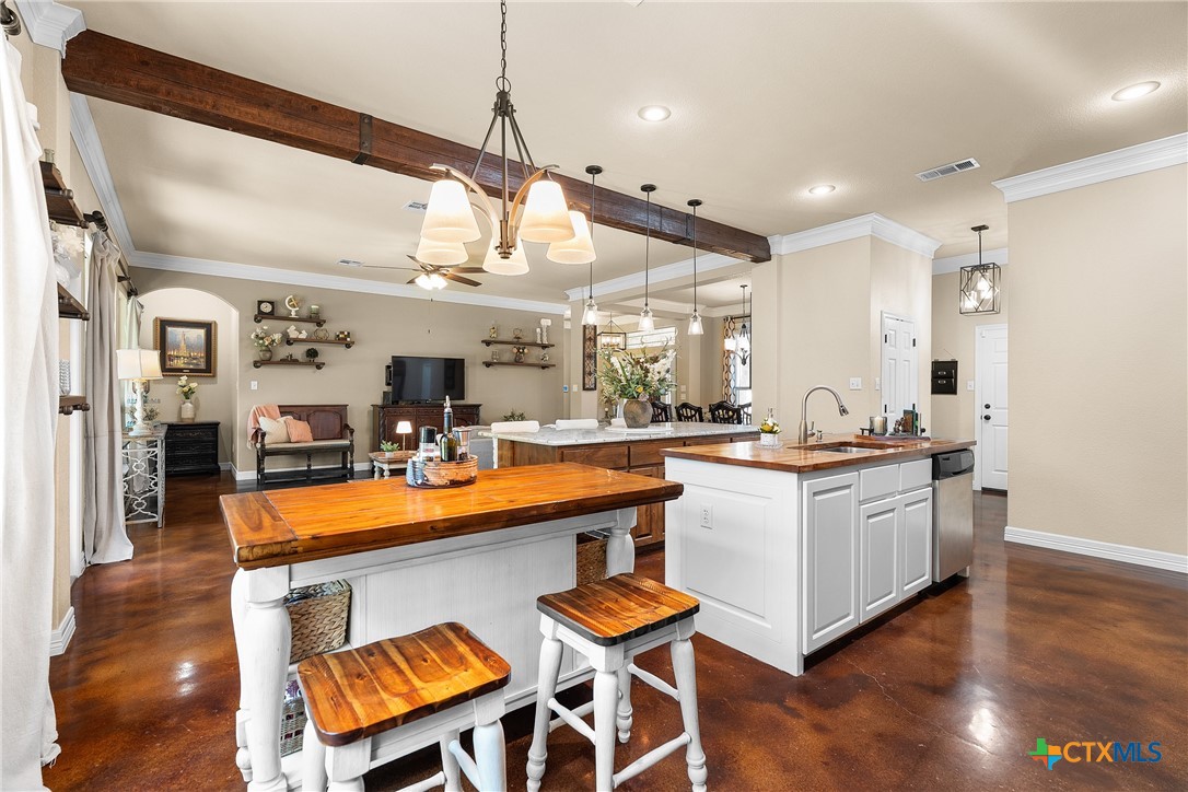 2405 Twin Ridge Court Belton, TX 76513 - Photo 12 of 30 a large white kitchen with a large window and stainless steel appliances