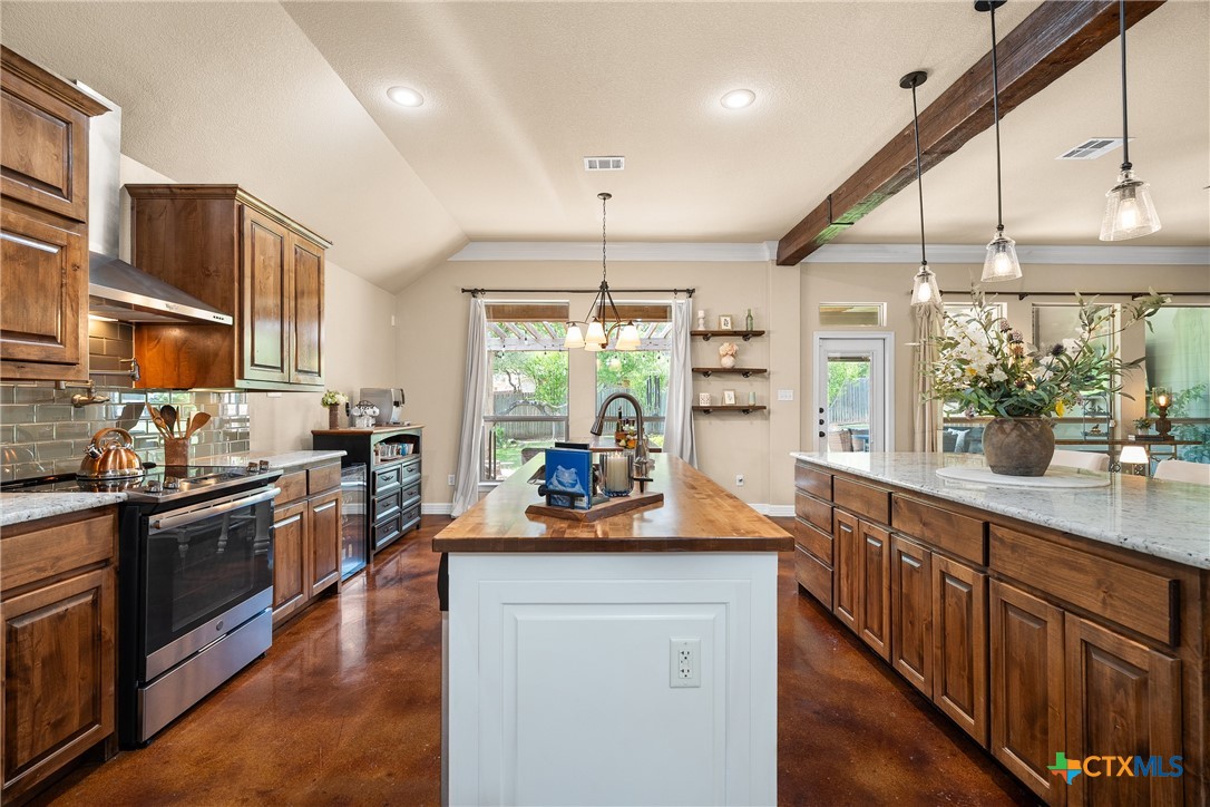 2405 Twin Ridge Court Belton, TX 76513 - Photo 13 of 30 a kitchen with stainless steel appliances granite countertop a stove and more cabinets