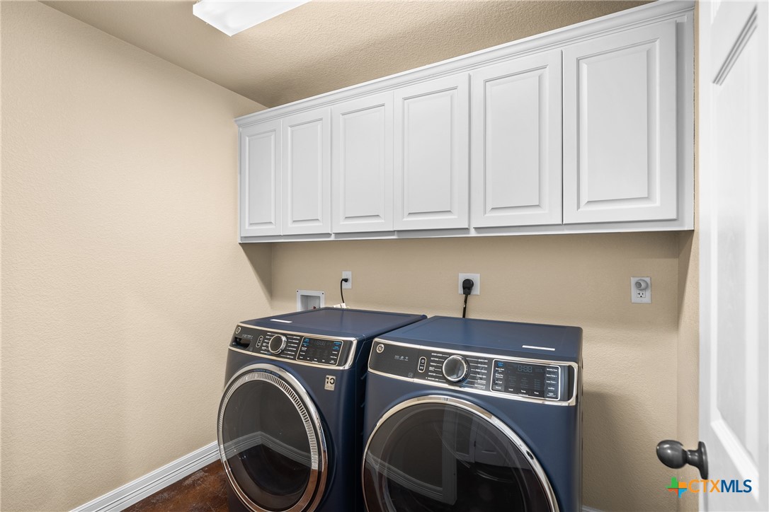 2405 Twin Ridge Court Belton, TX 76513 - Photo 16 of 30 a utility room with dryer and washer