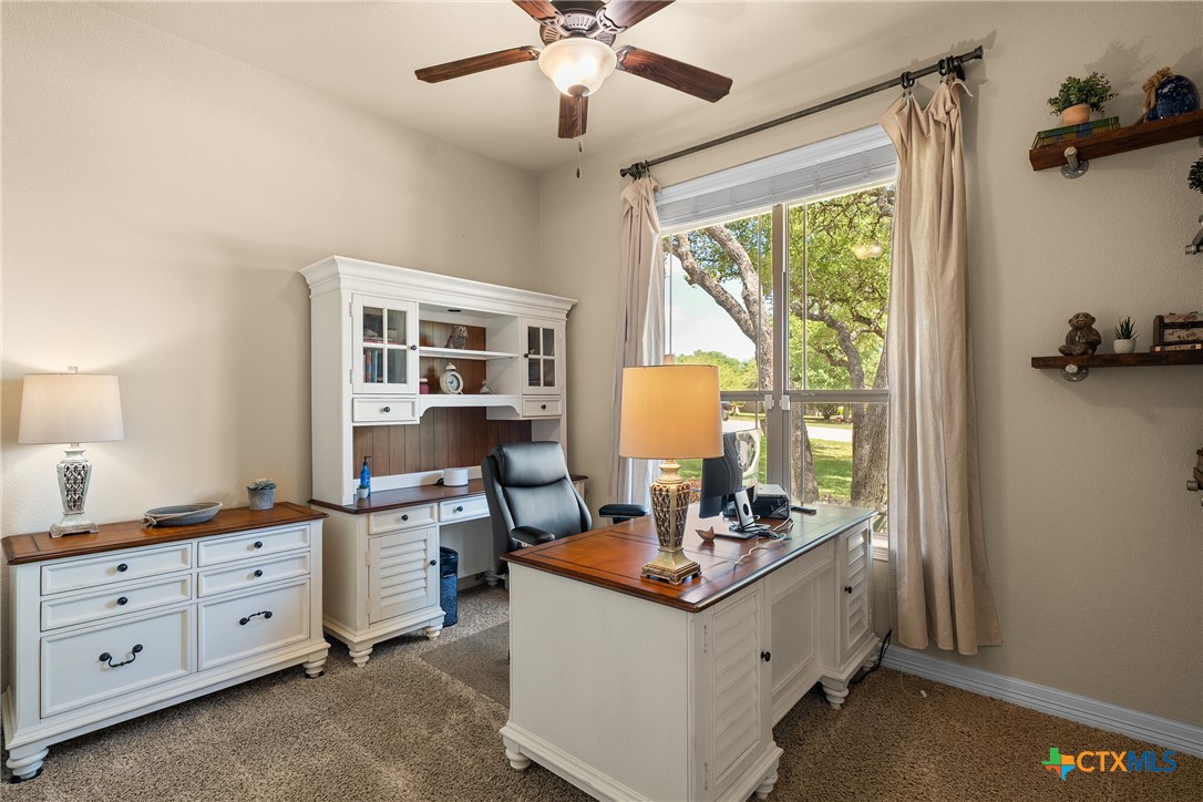 2405 Twin Ridge Court Belton, TX 76513 - Photo 18 of 30 a room with cabinets a table and a window