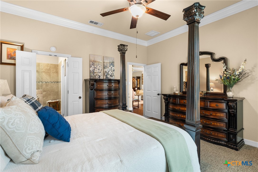 2405 Twin Ridge Court Belton, TX 76513 - Photo 22 of 30 a bedroom with a large bed and a dresser