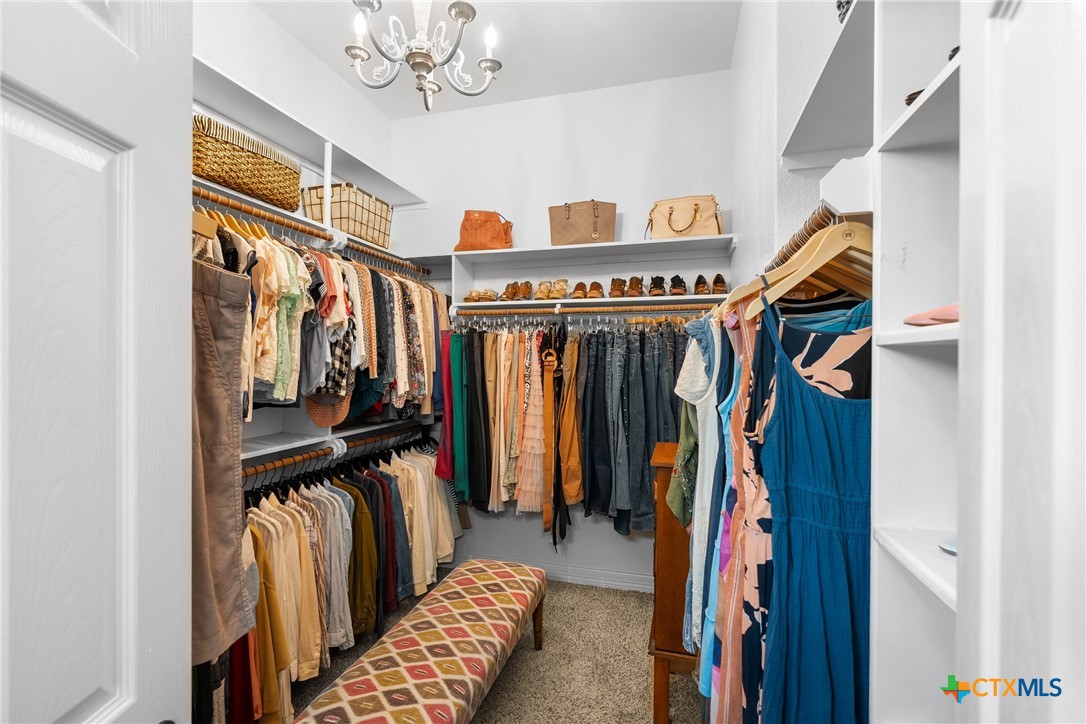2405 Twin Ridge Court Belton, TX 76513 - Photo 24 of 30 a view of walk in closet with clothes and shoes