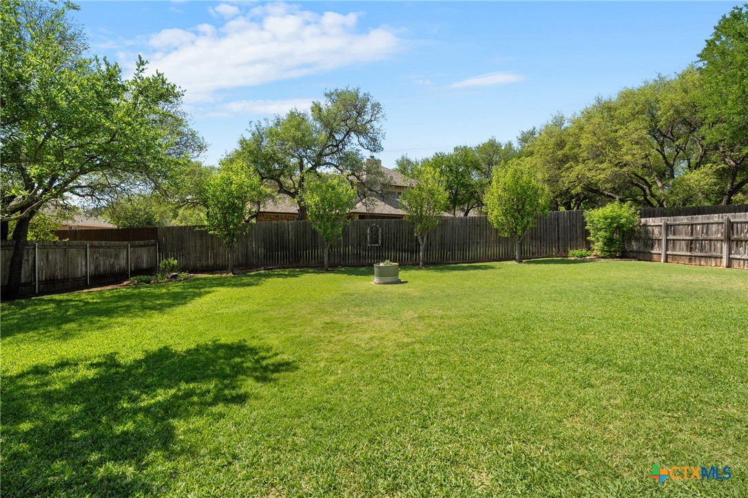 2405 Twin Ridge Court Belton, TX 76513 - Photo 28 of 30 a swimming pool with outdoor seating and yard