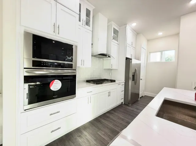 a large bathroom with a sink and a large mirror