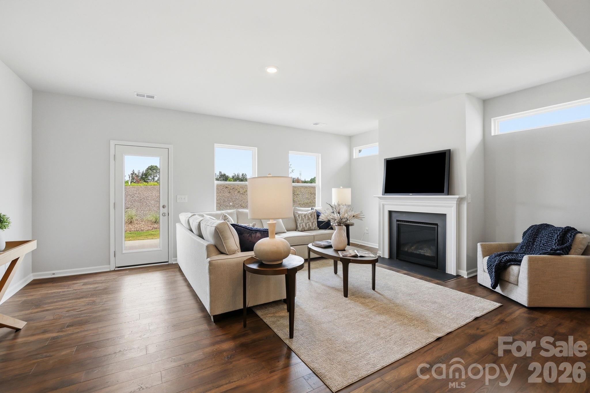 470 Brick House Road York, SC 29745 - Photo 20 of 39 a living room with furniture a fireplace and a flat screen tv