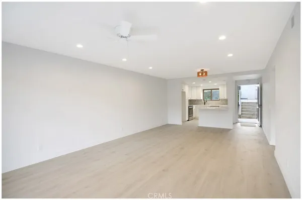 a view of kitchen and wooden floor
