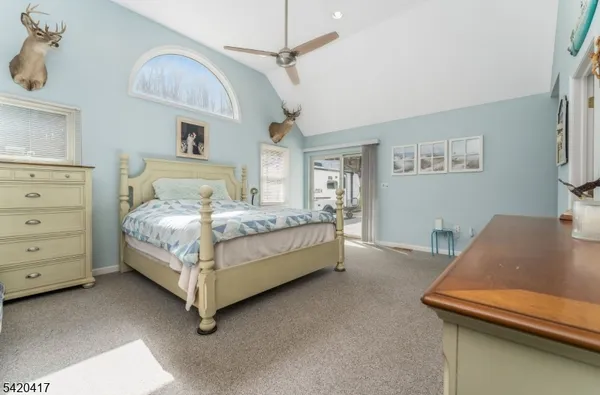 a bedroom with a bed and a desk