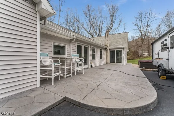 a view of a outdoor space with a patio and fire pit