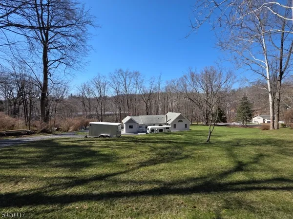 a view of a yard with trees