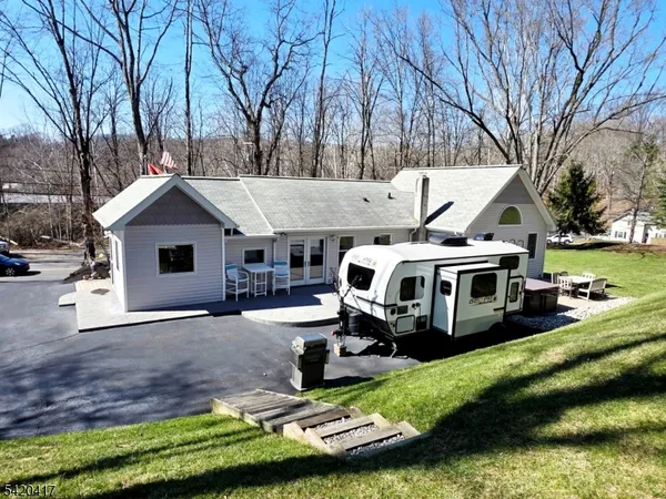 a view of a backyard with large trees