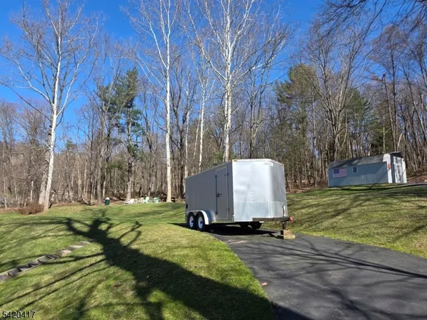 a view of a backyard with sitting area