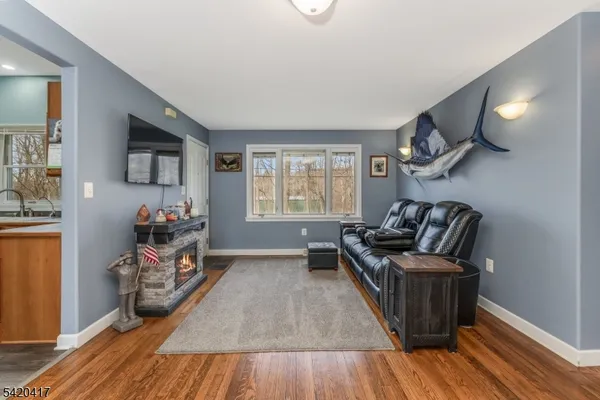 a view of a livingroom with furniture workspace and a window