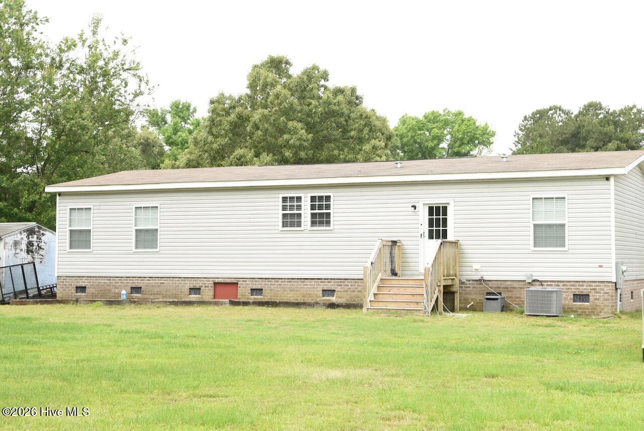 1430 Nixonton Road Elizabeth City, NC 27909 - Photo 5 of 30 The back side of 1430 Nixonton Road. A large backyard is behind.