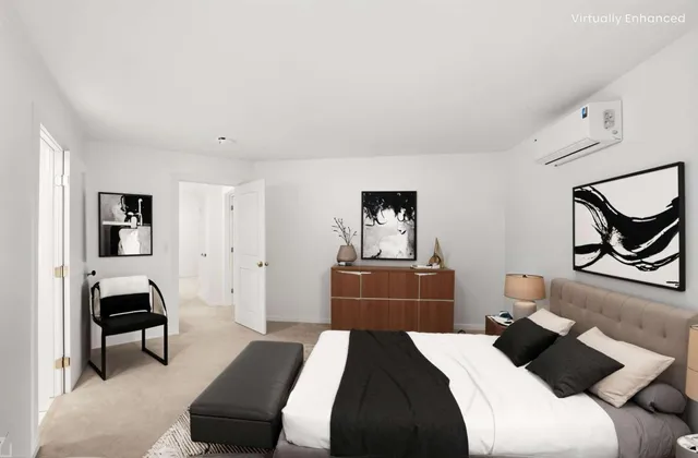 a bedroom with a bed and lamp