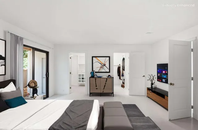 a bedroom with a bed and a couch