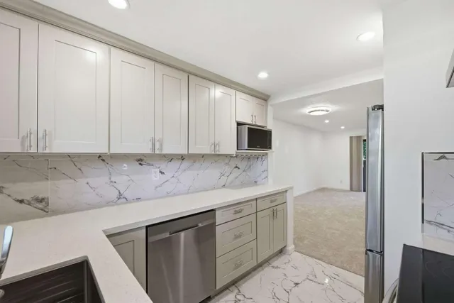 a kitchen with a sink and cabinets