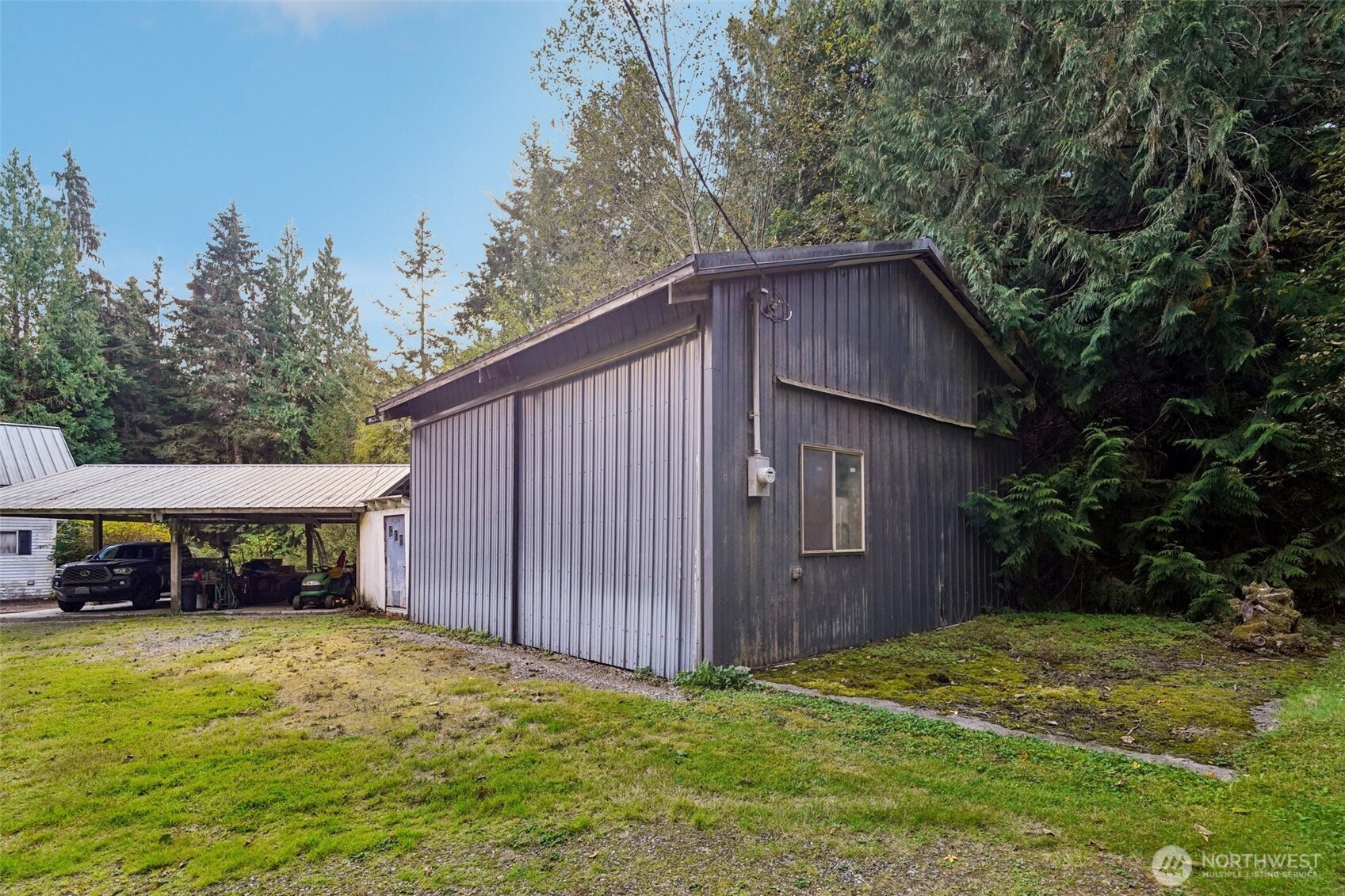 3150 Lily Lake Road Bow, WA 98232 - Photo 7 of 13 a backyard of a house with yard and trampoline