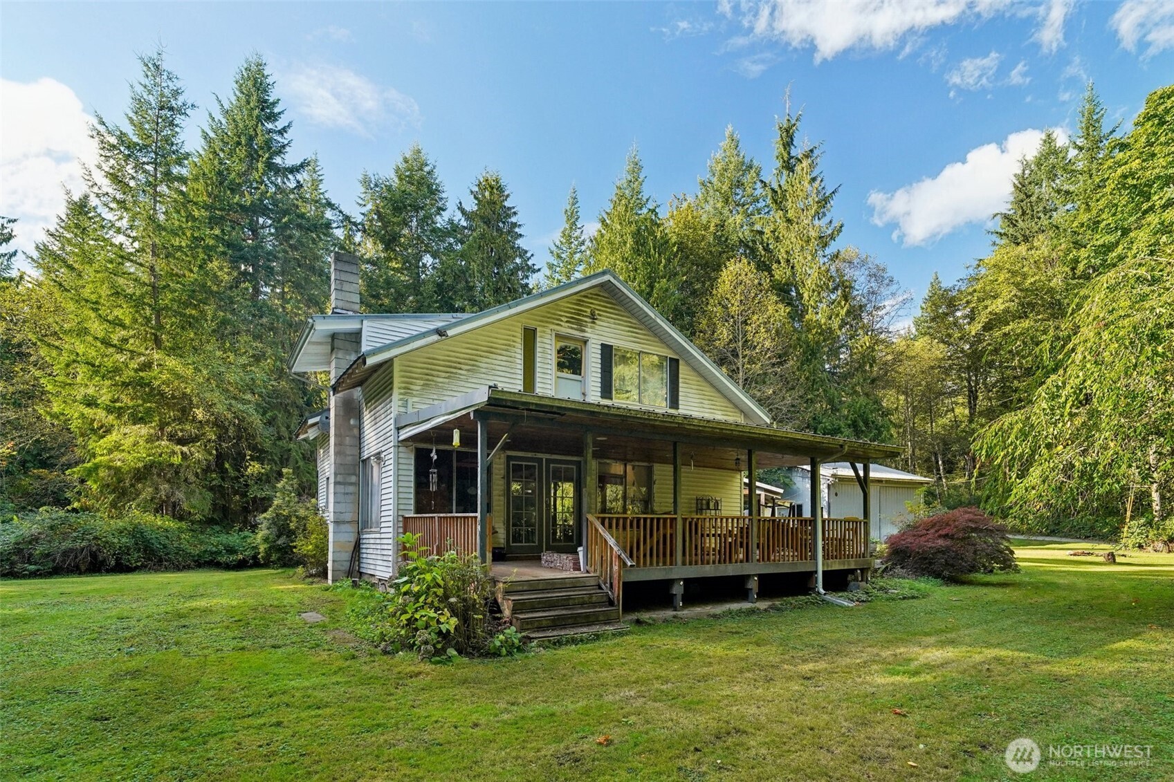 3150 Lily Lake Road Bow, WA 98232 - Photo 10 of 13 a front view of a house with a garden