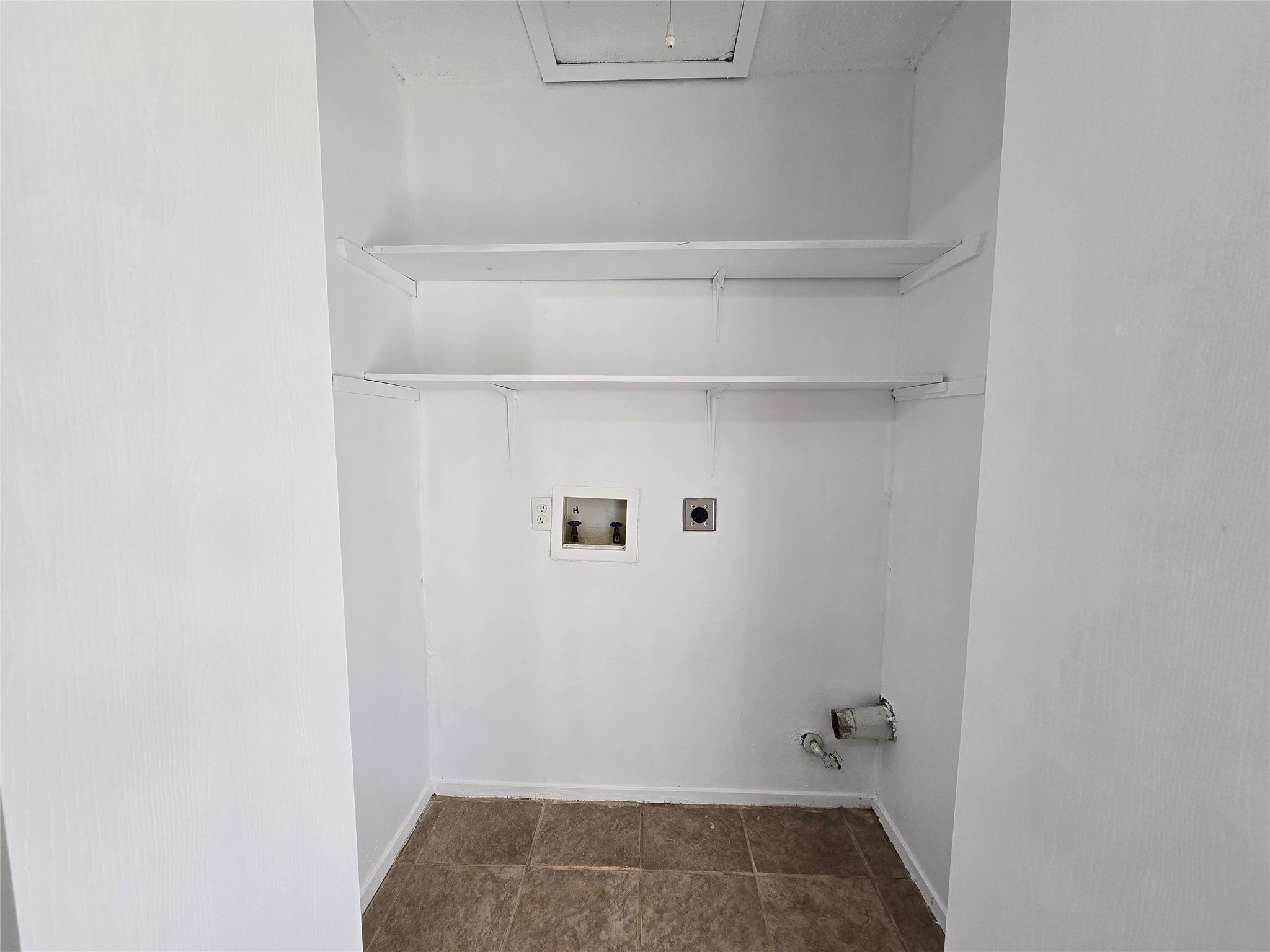 6206 Buffalo Pass, Unit A Austin, TX 78745 - Photo 18 of 24 A dedicated laundry closet offers convenient hookups and practical shelving for storage.