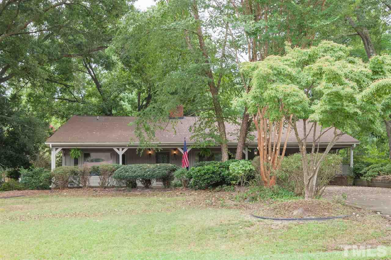 919 Grovemont Road Raleigh, NC 27603 - Photo 2 of 24 a front view of a house with a yard and trees