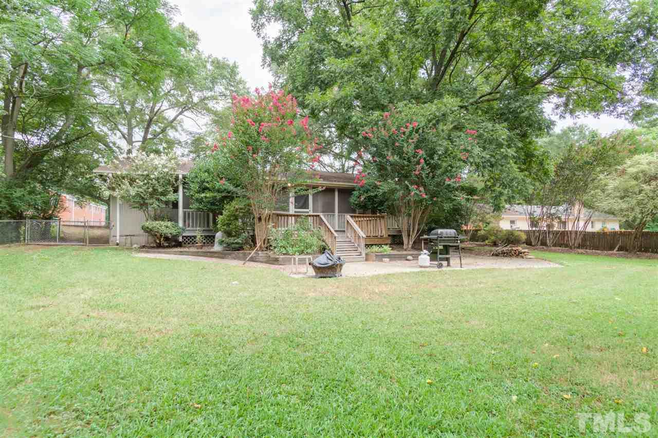 919 Grovemont Road Raleigh, NC 27603 - Photo 21 of 24 a view of a house with backyard and sitting area