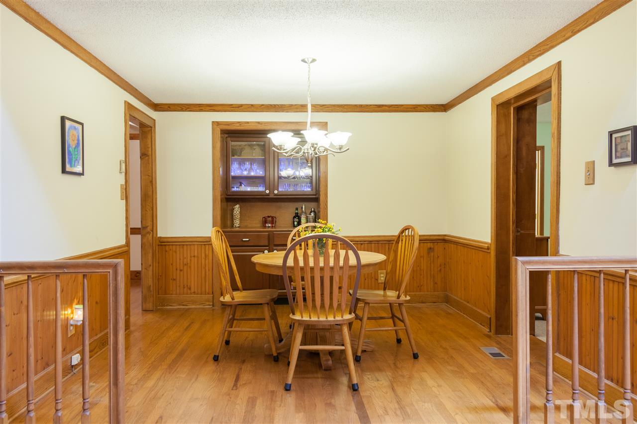 919 Grovemont Road Raleigh, NC 27603 - Photo 6 of 24 a view of a dining room with furniture window and wooden floor