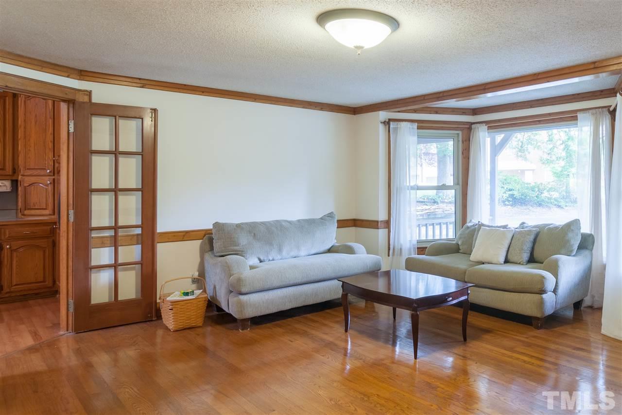 919 Grovemont Road Raleigh, NC 27603 - Photo 7 of 24 a living room with furniture and a large window