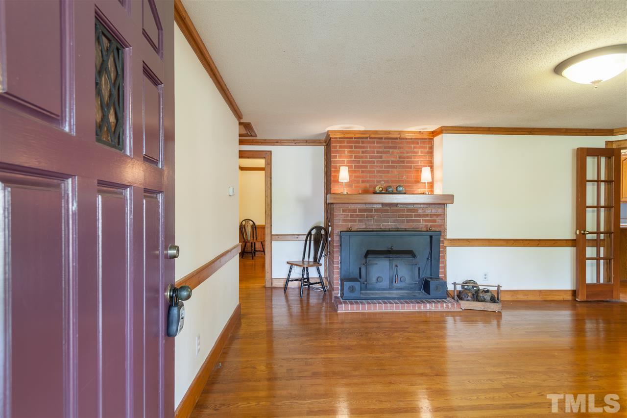 919 Grovemont Road Raleigh, NC 27603 - Photo 9 of 24 a living room with furniture and a fireplace