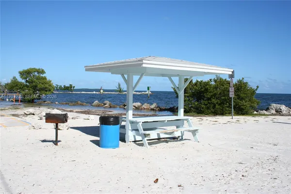 an outdoor space with furniture and umbrella