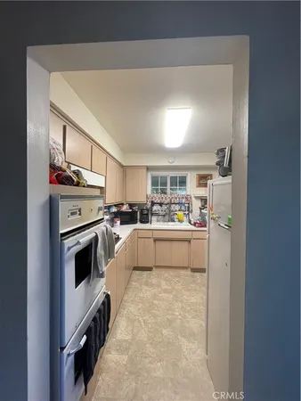 a view of a hallway and wooden floor