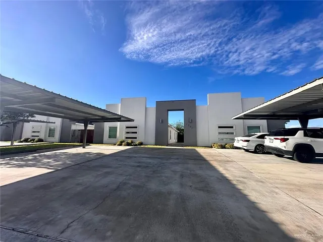 a view of a car parked in front of a house